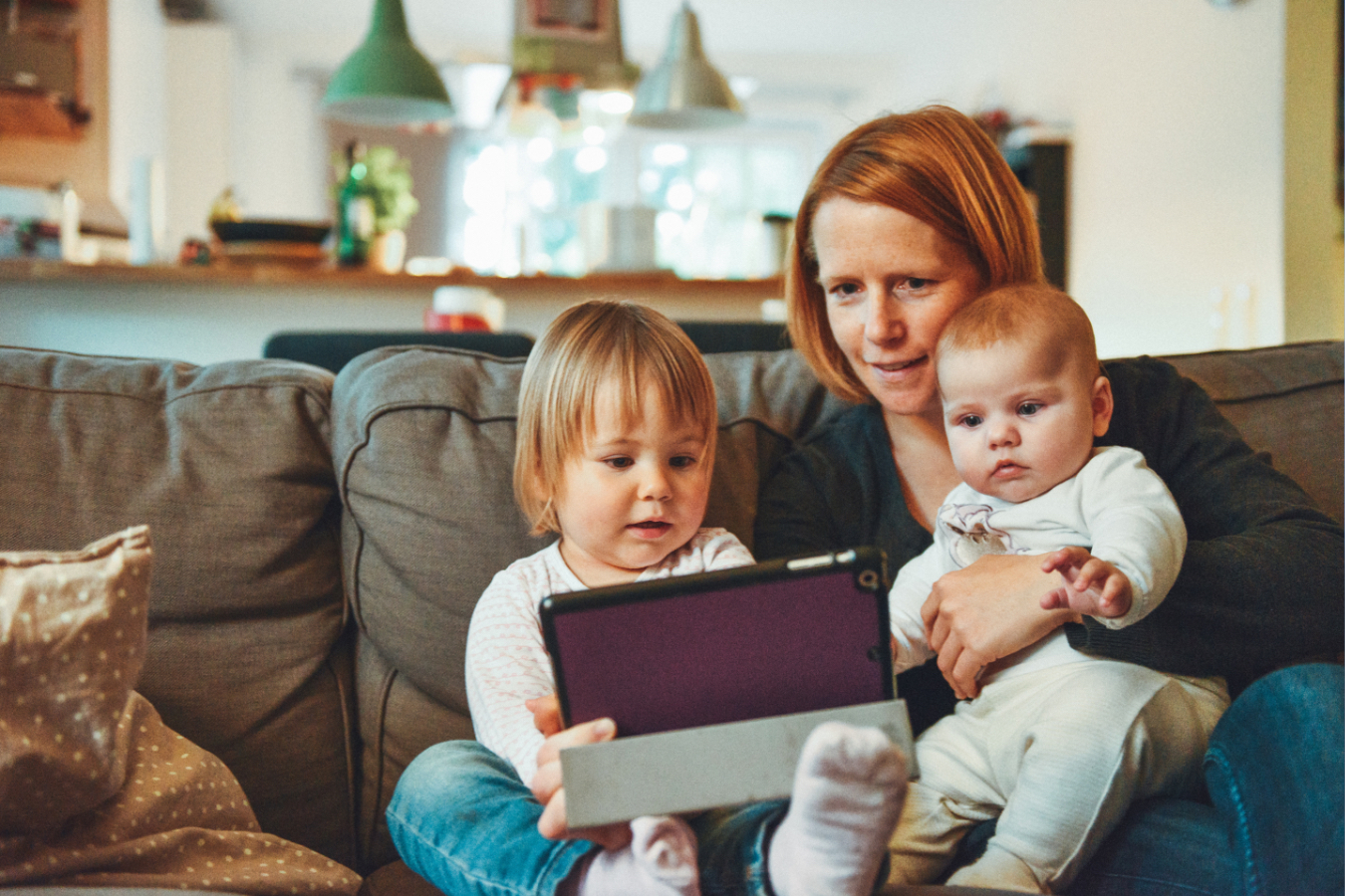 Mom with Two Kids Accessing a Tablet